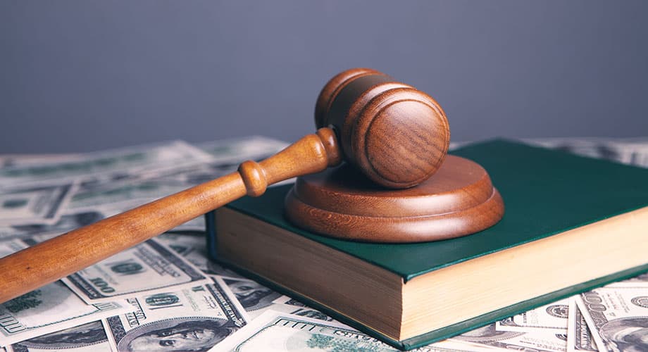 Legal gavel on law books
